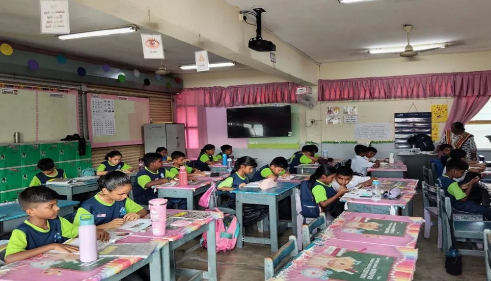 A full classroom of pupils working at their desks